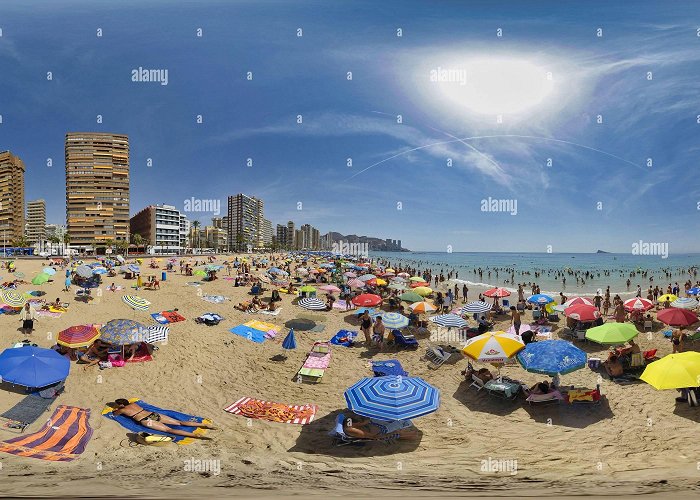 Levante beach 360° view of beachgoers in the sand of playa levante beach on a ... photo