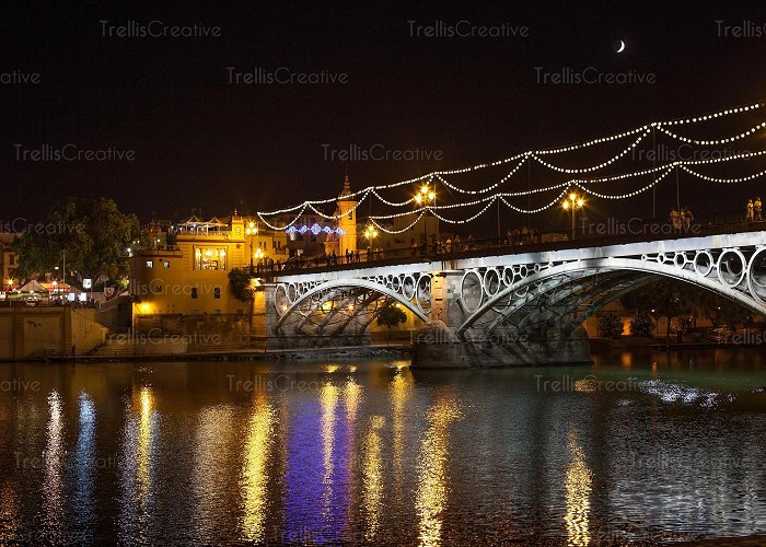 Triana Bridge - Isabel II Bridge Image: The Isabel II bridge, known as the Triana Bridge, over the ... photo